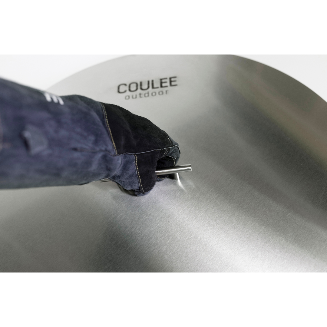 Lifting the stainless steel lid by its handle